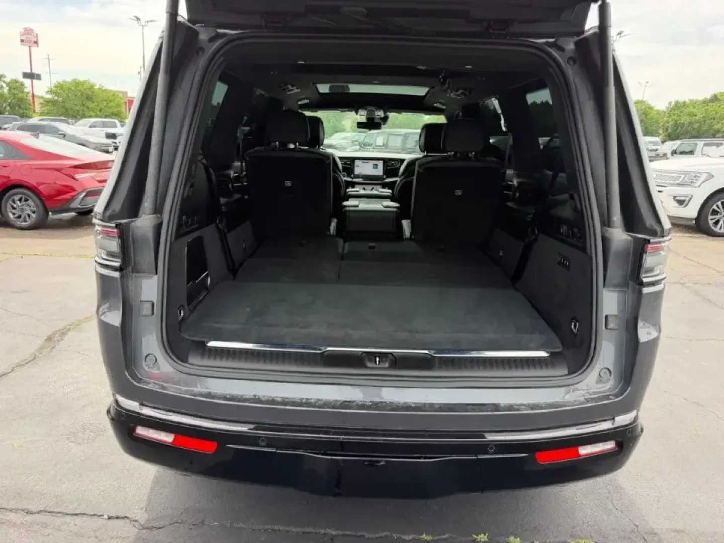 2024 /Global Black Leather Jeep Grand Wagoneer Series II (1C4SJVFP3RS) with an 3.0L I6 Hurricane HO Twin Turbo ESS engine, Automatic transmission, located at 970 Woodlawn Dr., Farmington, MO, 63640, (573) 431-7800, 37.825642, -90.468674 - Built for big weekends, long road trips, and everyday luxury family duty, this **2024 Jeep Grand Wagoneer Series II** is the kind of SUV that turns a simple drive into an event. Whether you're loading up for a lakeside getaway, shuttling kids and friends across town, or commuting in comfort from Far - Photo#4