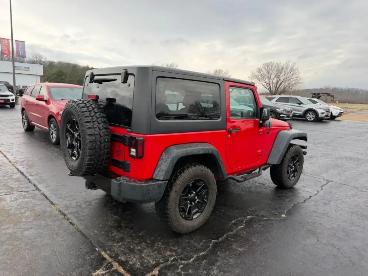 2014 /Black Cloth Jeep Wrangler Willys Wheeler (1C4AJWAG4EL) with an 3.6L V6 24V VVT engine, Automatic transmission, located at 970 Woodlawn Dr., Farmington, MO, 63640, (573) 431-7800, 37.825642, -90.468674 - Discover the thrill of adventure with this outstanding 2014 Jeep Wrangler Willys Wheeler, the perfect companion for weekend escapades and outdoor enthusiasts! Designed for those who crave off-road excitement and versatility, this SUV offers a unique blend of rugged capability and modern comforts. Wh - Photo#2