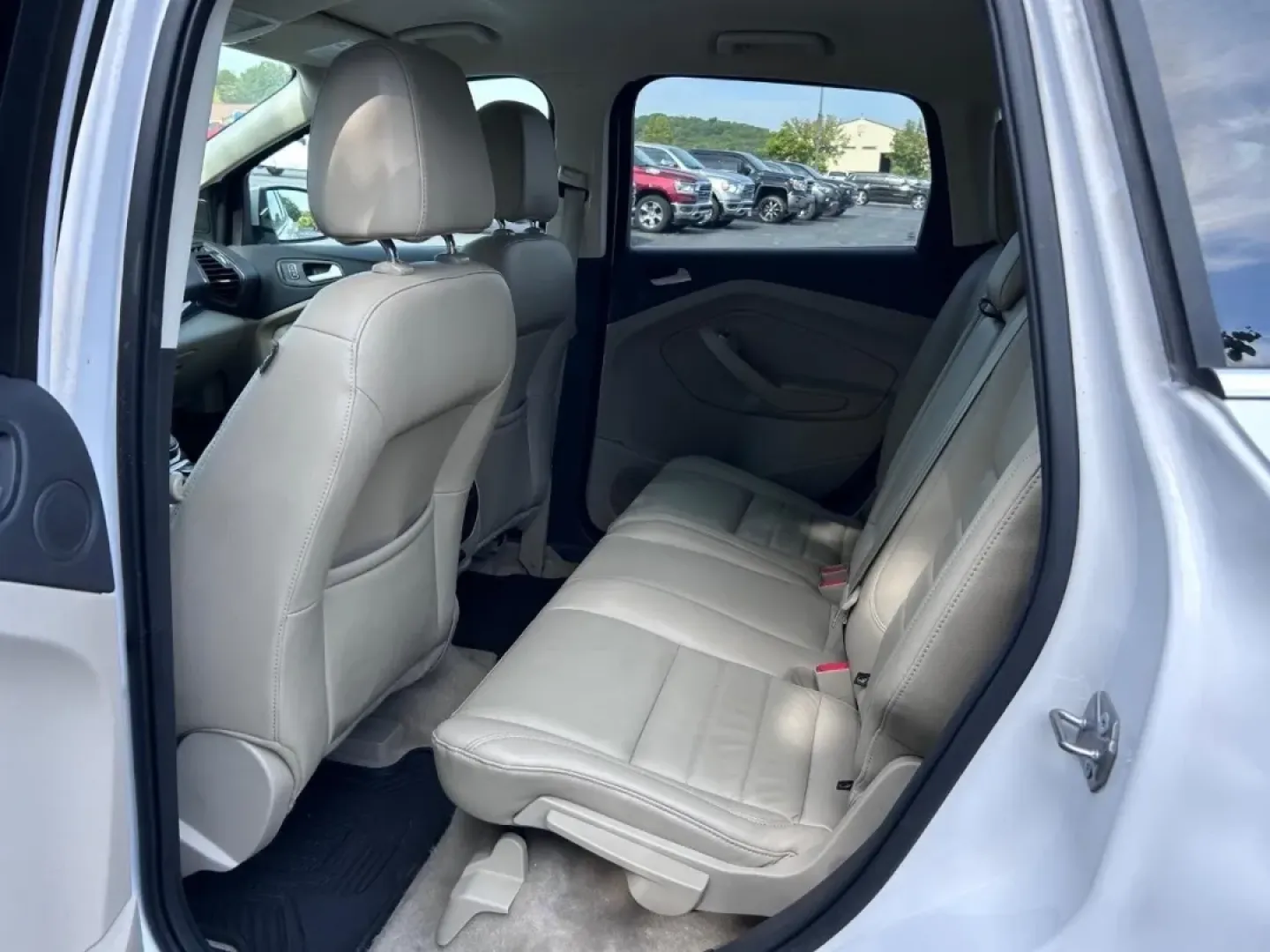 2016 /Medium Light Stone Leather Ford Escape Titanium (1FMCU0JX8GU) with an 1.6L EcoBoost engine, Automatic transmission, located at 970 Woodlawn Dr., Farmington, MO, 63640, (573) 431-7800, 37.825642, -90.468674 - Are you ready for your next adventure? Whether you're commuting to work, taking the family on a weekend getaway, or exploring the scenic routes around Farmington, the 2016 Ford Escape Titanium is the perfect companion for all your journeys. With its spacious interior, advanced technology, and except - Photo#9