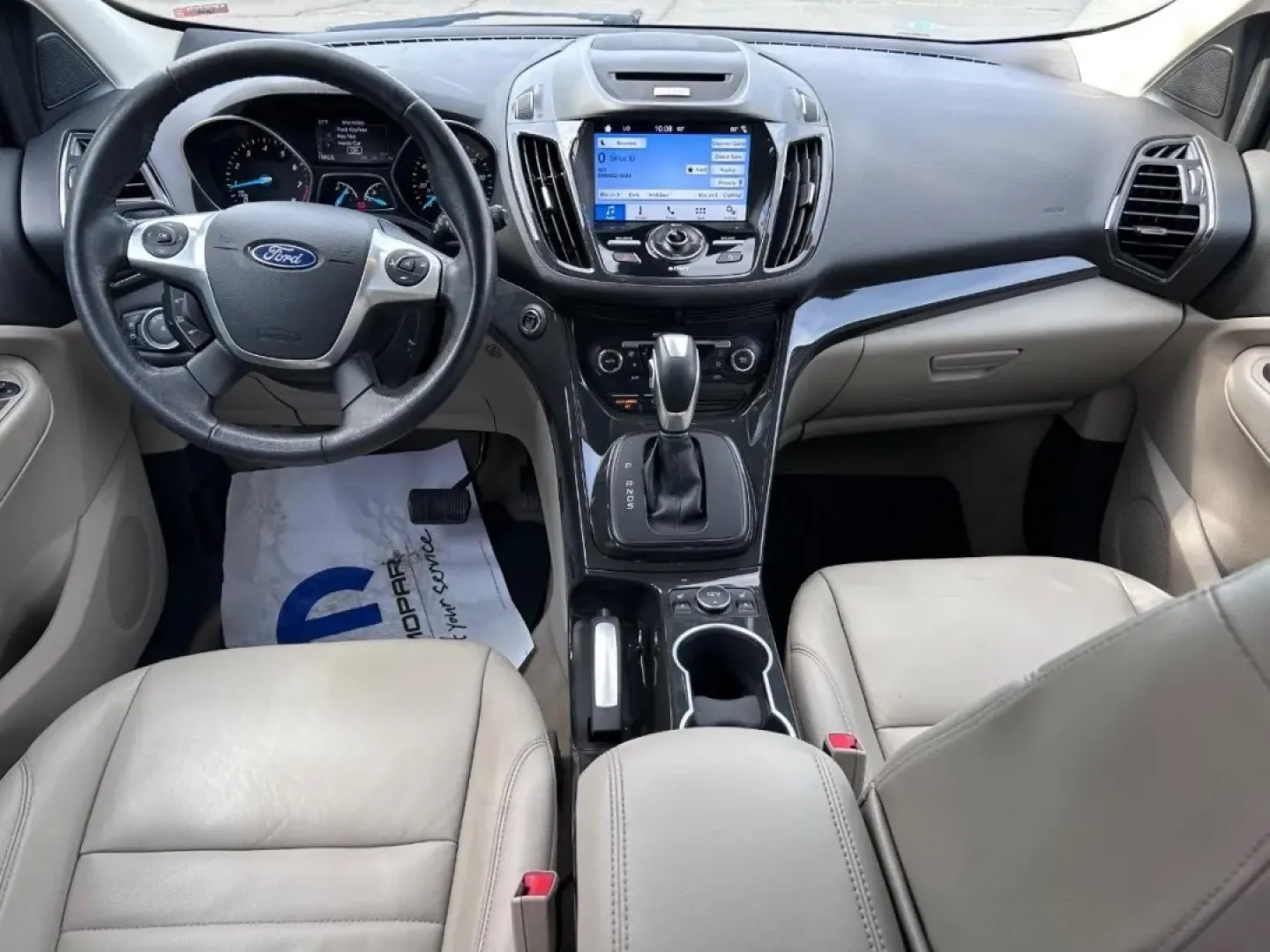 2016 /Medium Light Stone Leather Ford Escape Titanium (1FMCU0JX8GU) with an 1.6L EcoBoost engine, Automatic transmission, located at 970 Woodlawn Dr., Farmington, MO, 63640, (573) 431-7800, 37.825642, -90.468674 - Are you ready for your next adventure? Whether you're commuting to work, taking the family on a weekend getaway, or exploring the scenic routes around Farmington, the 2016 Ford Escape Titanium is the perfect companion for all your journeys. With its spacious interior, advanced technology, and except - Photo#10