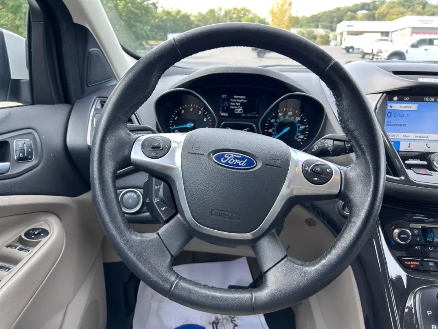 2016 /Medium Light Stone Leather Ford Escape Titanium (1FMCU0JX8GU) with an 1.6L EcoBoost engine, Automatic transmission, located at 970 Woodlawn Dr., Farmington, MO, 63640, (573) 431-7800, 37.825642, -90.468674 - Are you ready for your next adventure? Whether you're commuting to work, taking the family on a weekend getaway, or exploring the scenic routes around Farmington, the 2016 Ford Escape Titanium is the perfect companion for all your journeys. With its spacious interior, advanced technology, and except - Photo#11