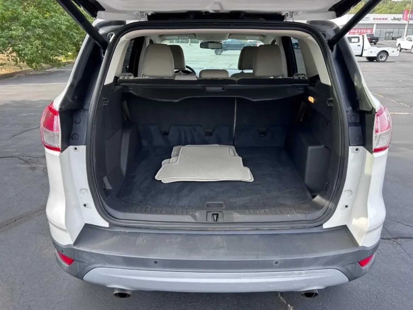 2016 /Medium Light Stone Leather Ford Escape Titanium (1FMCU0JX8GU) with an 1.6L EcoBoost engine, Automatic transmission, located at 970 Woodlawn Dr., Farmington, MO, 63640, (573) 431-7800, 37.825642, -90.468674 - Are you ready for your next adventure? Whether you're commuting to work, taking the family on a weekend getaway, or exploring the scenic routes around Farmington, the 2016 Ford Escape Titanium is the perfect companion for all your journeys. With its spacious interior, advanced technology, and except - Photo#4
