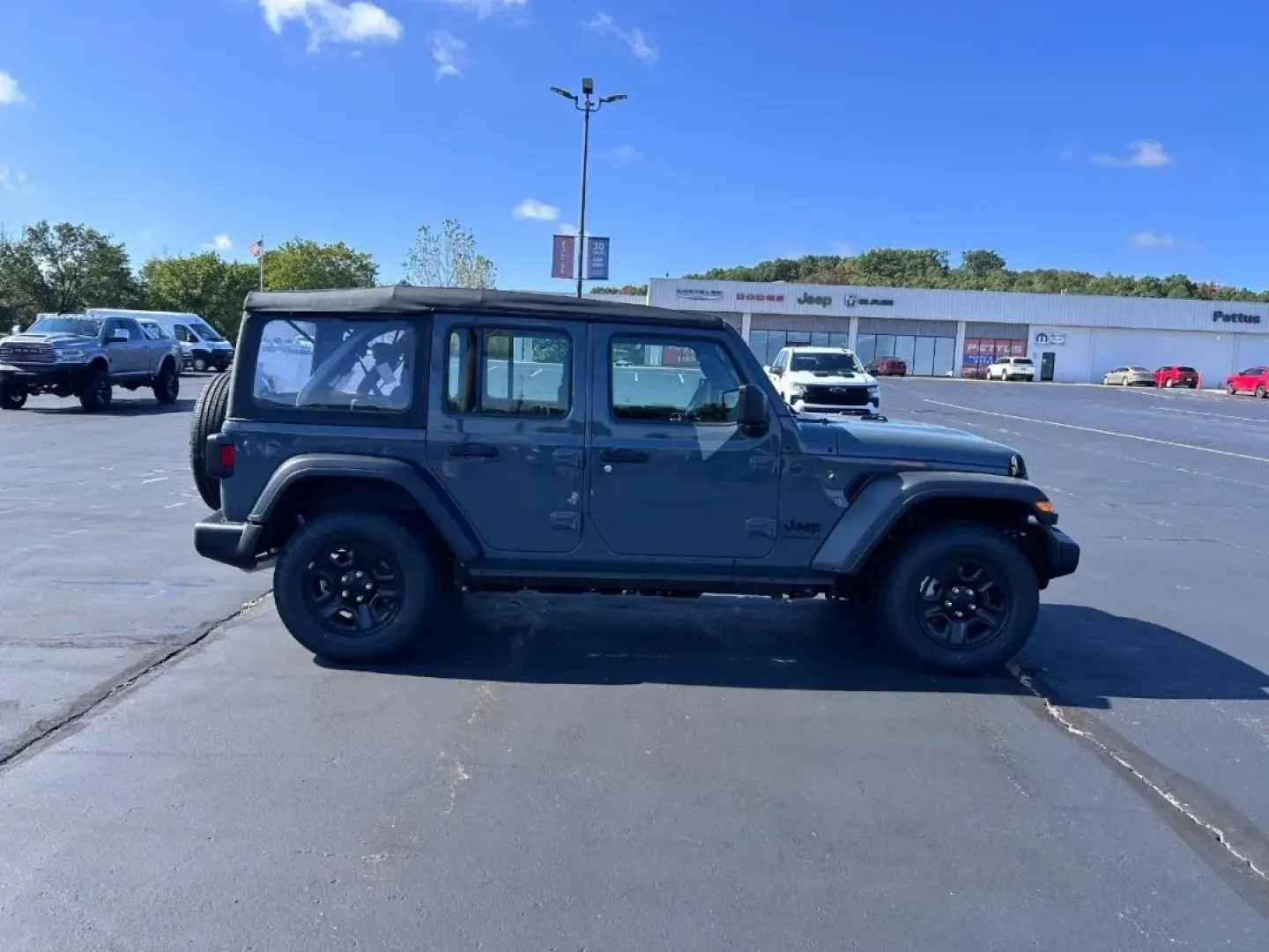2025 /Black Cloth Jeep Wrangler Sport (1C4PJXDN2SW) with an 2.0L engine, located at 970 Woodlawn Dr., Farmington, MO, 63640, (573) 431-7800, 37.825642, -90.468674 - **Unleash Your Weekend Warrior: 2025 Jeep Wrangler at Pettus CDJR Farmington**<br /> <br /> Are you ready to take your weekend adventures to the next level? The 2025 Jeep Wrangler at Pettus CDJR Farmington is the perfect companion for those who crave the thrill of off-road escapades and the comfort - Photo#1