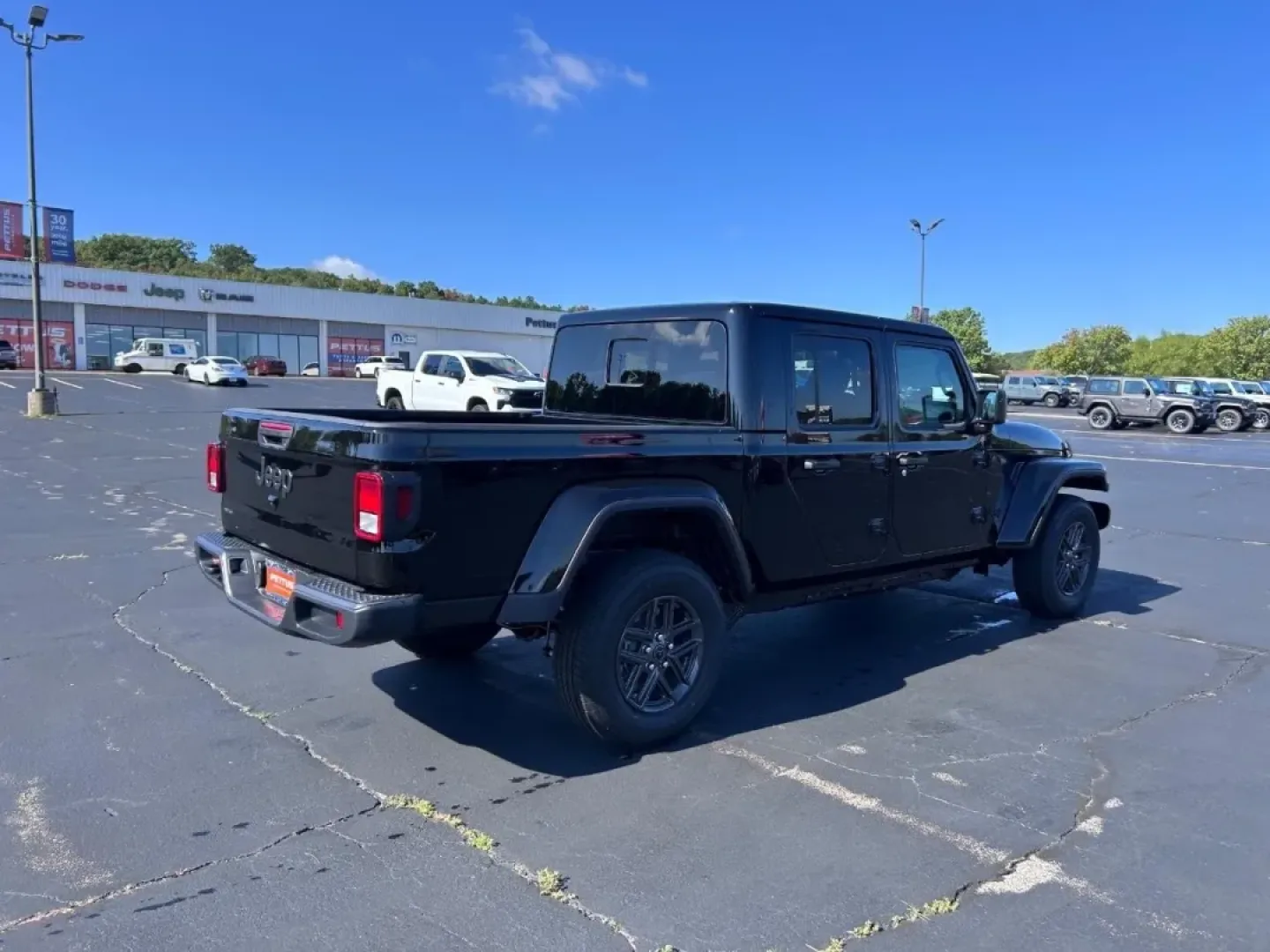 2025 /Black Cloth Jeep Gladiator Sport (1C6PJTAG5SL) with an 3.6L V6 24V VVT UPG I engine, Automatic transmission, located at 970 Woodlawn Dr., Farmington, MO, 63640, (573) 431-7800, 37.825642, -90.468674 - Are you ready for your next adventure? If you're seeking a vehicle that combines rugged capability with everyday practicality, look no further than the 2025 Jeep Gladiator available at Pettus CDJR Farmington. This exceptional truck is engineered to provide the ultimate driving experience, whether yo - Photo#2