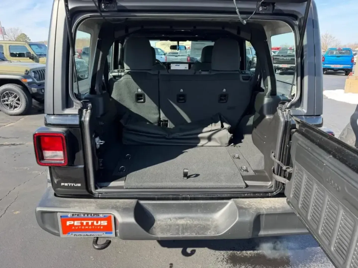 2026 /Black Cloth Jeep Wrangler Sport (1C4PJXDN4TW) with an 2.0L engine, 6M transmission, located at 970 Woodlawn Dr., Farmington, MO, 63640, (573) 431-7800, 37.825642, -90.468674 - Embark on your next adventure with the 2026 Jeep Wrangler, a vehicle that perfectly blends rugged capability with everyday practicality. Whether you're navigating the bustling streets of Farmington or conquering the trails of nearby Washington State Park, this SUV is designed for those who crave exp - Photo#4