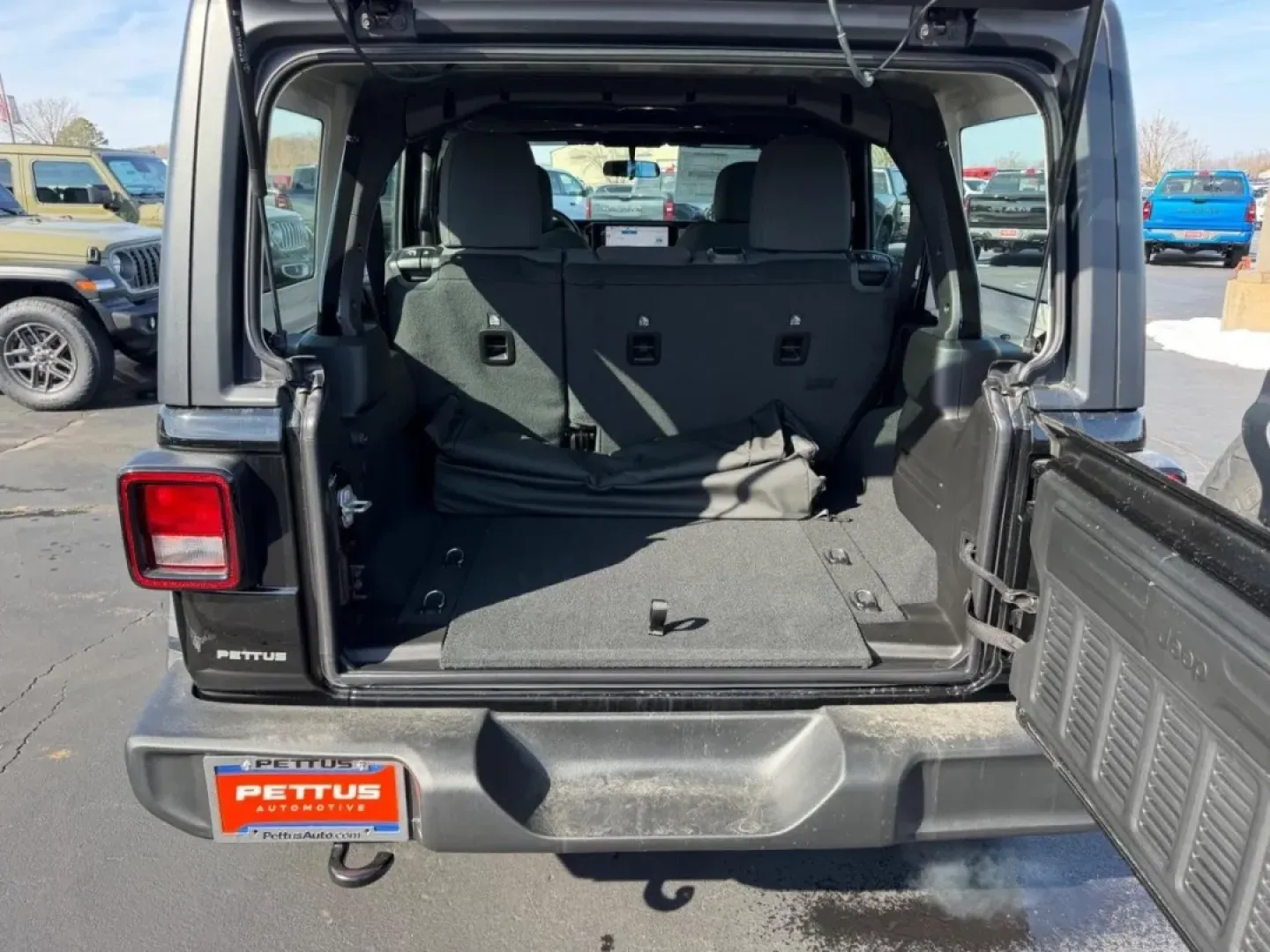 2026 /Black Cloth Jeep Wrangler Sport (1C4PJXDN4TW) with an 2.0L engine, 6M transmission, located at 970 Woodlawn Dr., Farmington, MO, 63640, (573) 431-7800, 37.825642, -90.468674 - Embark on your next adventure with the 2026 Jeep Wrangler, a vehicle that perfectly blends rugged capability with everyday practicality. Whether you're navigating the bustling streets of Farmington or conquering the trails of nearby Washington State Park, this SUV is designed for those who crave exp - Photo#4