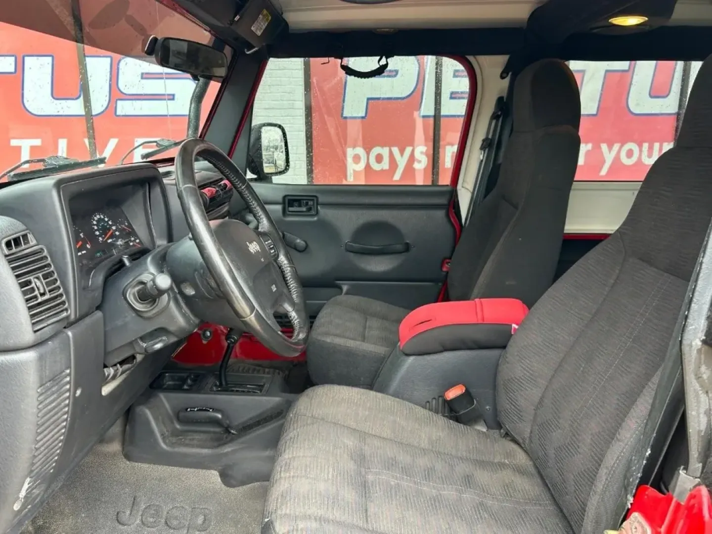 2004 /Dark Gray Cloth Jeep Wrangler Unlimited (1J4FA49S54P) with an 4.0L SMPI I6 engine, Automatic transmission, located at 970 Woodlawn Dr., Farmington, MO, 63640, (573) 431-7800, 37.825642, -90.468674 - Weekend trails, lake days, and top-down backroad drives are what the Jeep Wrangler was built for-and this 2004 Jeep Wrangler Sport makes it easy to turn an ordinary Saturday into an Ozarks-style adventure. With classic Wrangler simplicity, true Four Wheel Drive capability, and just 84,802 miles, it' - Photo#6