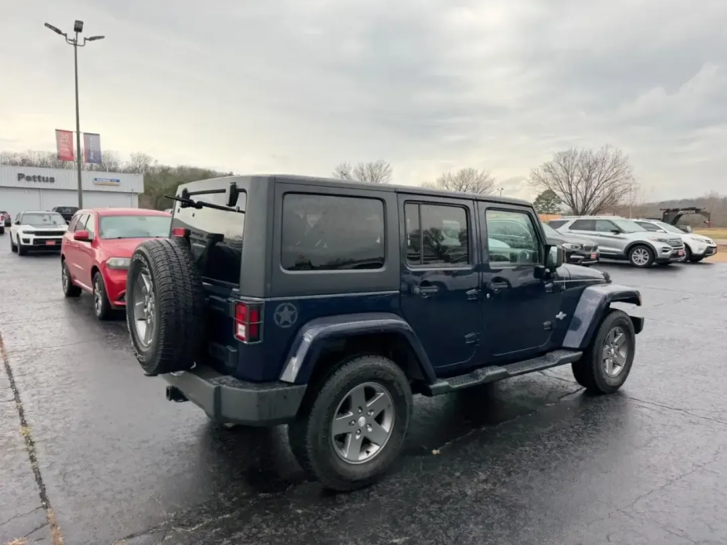 2013 /Black Interior Leather Trimmed Jeep Wrangler Unlimited Freedom Edition (1C4BJWDG7DL) with an 3.6L SMPI 24V VVT V6 engine, Automatic transmission, located at 970 Woodlawn Dr., Farmington, MO, 63640, (573) 431-7800, 37.825642, -90.468674 - Weekend trail runs, summer float trips, and spontaneous road trips down Highway 67 feel a lot more possible when your SUV is built for adventure and everyday practicality. This 2013 Jeep Wrangler Unlimited Freedom Edition is the kind of vehicle that fits an active Missouri lifestyle-roomy enough for - Photo#2