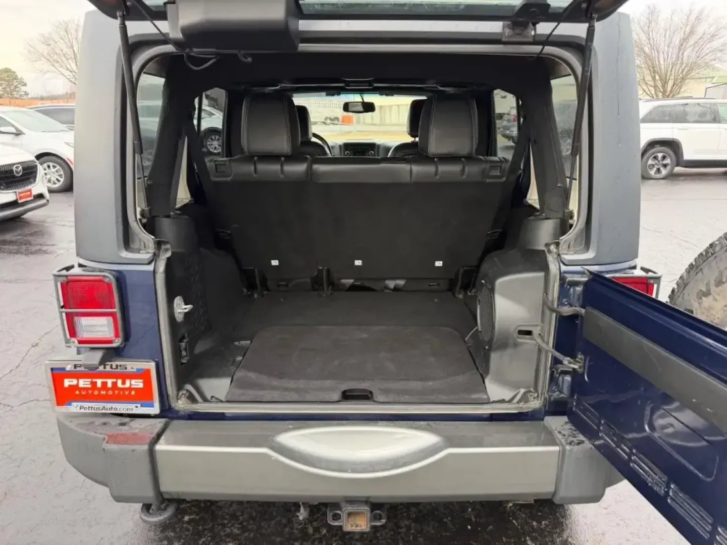 2013 /Black Interior Leather Trimmed Jeep Wrangler Unlimited Freedom Edition (1C4BJWDG7DL) with an 3.6L SMPI 24V VVT V6 engine, Automatic transmission, located at 970 Woodlawn Dr., Farmington, MO, 63640, (573) 431-7800, 37.825642, -90.468674 - Weekend trail runs, summer float trips, and spontaneous road trips down Highway 67 feel a lot more possible when your SUV is built for adventure and everyday practicality. This 2013 Jeep Wrangler Unlimited Freedom Edition is the kind of vehicle that fits an active Missouri lifestyle-roomy enough for - Photo#4