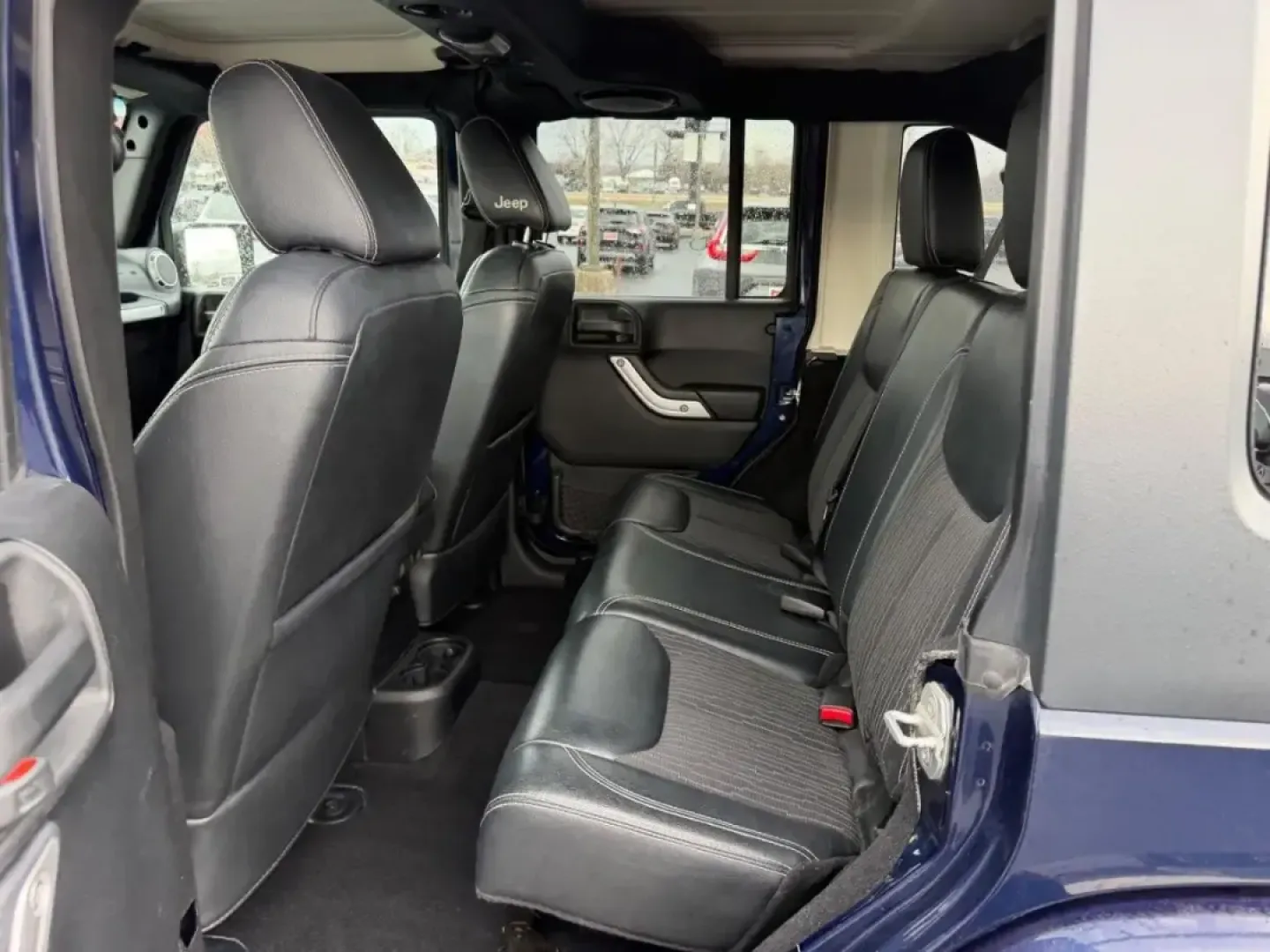 2013 /Black Interior Leather Trimmed Jeep Wrangler Unlimited Freedom Edition (1C4BJWDG7DL) with an 3.6L SMPI 24V VVT V6 engine, Automatic transmission, located at 970 Woodlawn Dr., Farmington, MO, 63640, (573) 431-7800, 37.825642, -90.468674 - Weekend trail runs, summer float trips, and spontaneous road trips down Highway 67 feel a lot more possible when your SUV is built for adventure and everyday practicality. This 2013 Jeep Wrangler Unlimited Freedom Edition is the kind of vehicle that fits an active Missouri lifestyle-roomy enough for - Photo#8