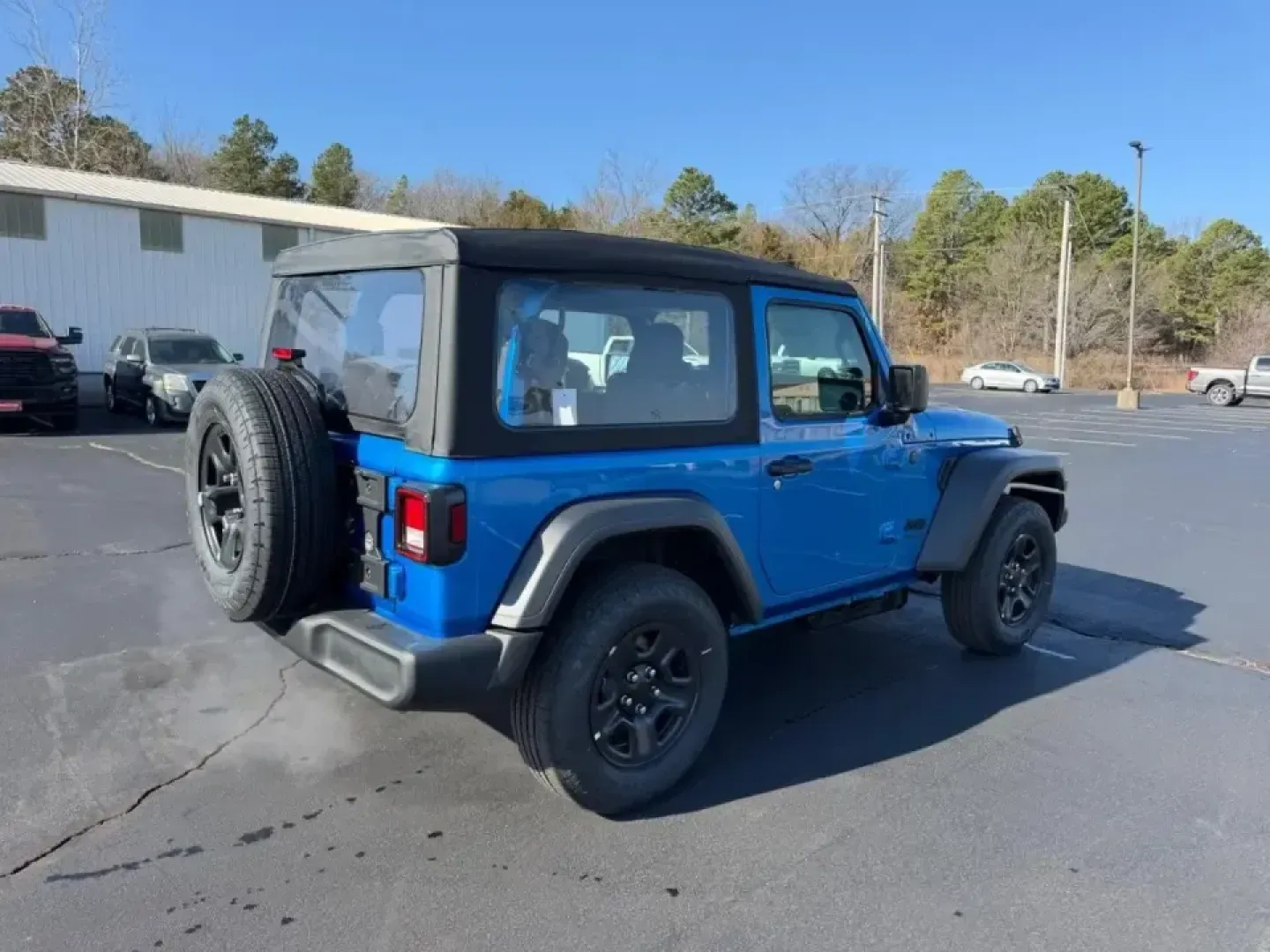 2026 /Black Cloth Jeep Wrangler Sport (1C4PJXAN5TW) with an 2.0L engine, 6M transmission, located at 970 Woodlawn Dr., Farmington, MO, 63640, (573) 431-7800, 37.825642, -90.468674 - Weekend trails, lake days, and winter-weather confidence all start with the right SUV-and this **2026 Jeep Wrangler Sport 4x4** is built for the Farmington lifestyle. Whether you're packing up for a quick escape to **St. Joe State Park**, heading out toward **Flat River** for fishing, or just commut - Photo#2