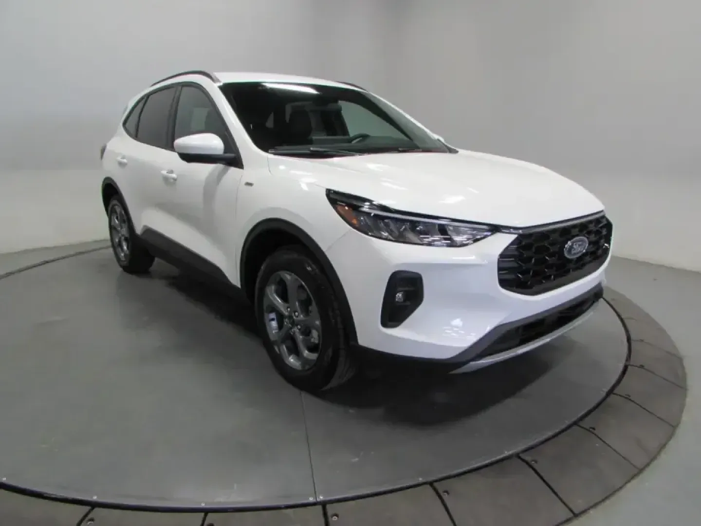 2026 /Ebony Ford Escape ST-Line Select (1FMCU9NZ4TU) with an 2.5L iVCT Atkinson Cycle I-4 Hybrid engine, CVT transmission, located at 12836 Highway 21, De Soto, MO, 63020, (636) 337-7777, 38.151867, -90.575615 - Picture your weekdays getting easier and your weekends getting bigger: a hybrid SUV that sips fuel on the commute, stays confident in Missouri weather, and still feels sporty when you head out for a day trip. This **2026 Ford Escape ST-Line Select Hybrid AWD** in **Star White** is built for real lif - Photo#0