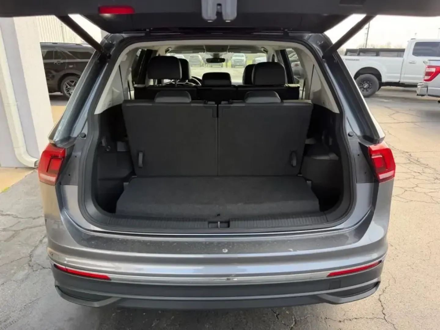 2024 /Titan Black w/Orange Leather Volkswagen Tiguan 2.0T Wolfsburg Edition (3VV6B7AX6RM) with an 2.0L TSI DOHC 16-Valve Turbocharged 4-Cyl engine, Automatic transmission, located at 141 Commercial Dr, Fredericktown, MO, 63645, (573) 783-6432, 37.570087, -90.320648 - Need one SUV that can handle the weekday school-and-work shuffle and still feel ready for a weekend escape down Highway 67? This **2024 Volkswagen Tiguan Wolfsburg Edition** is built for real life in Southeast Missouri-comfortable for long commutes, easy to park around town, and roomy enough for roa - Photo#4