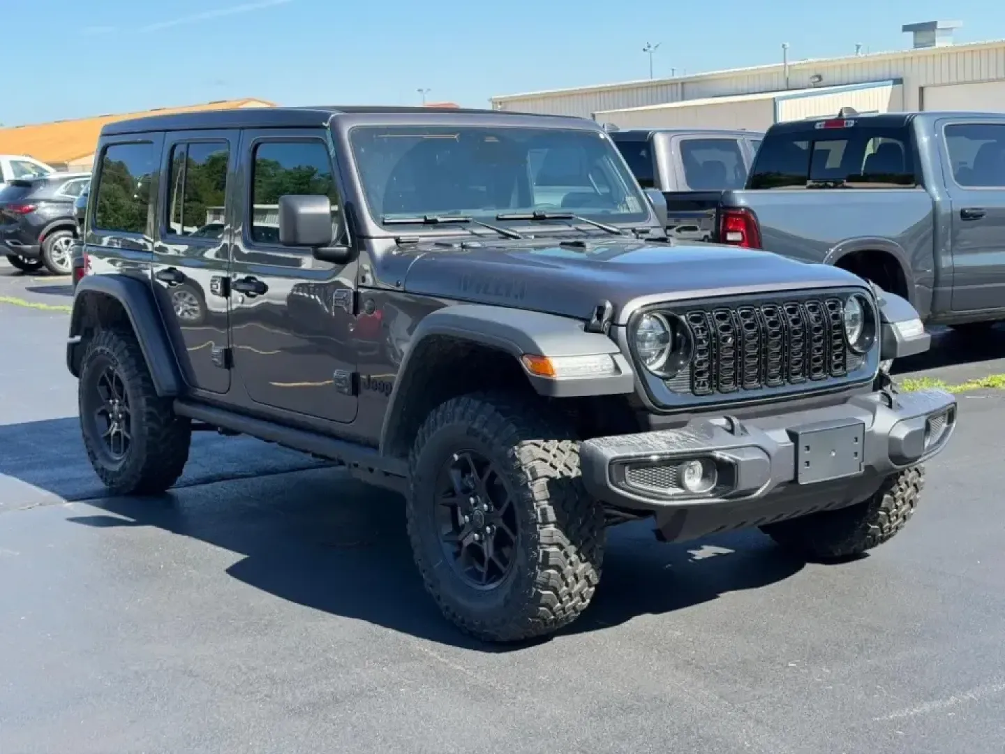 2026 /Black Cloth Jeep Wrangler Willys (1C4PJXDNXTW) with an 2.0L engine, 6M transmission, located at 970 Woodlawn Dr., Farmington, MO, 63640, (573) 431-7800, 37.825642, -90.468674 - Weekend trail runs at St. Joe State Park, a top-down cruise through downtown Farmington, or a confident commute out toward Park Hills and Bonne Terre-this 2026 Jeep Wrangler Sport is built for the kind of life that doesn't stay on pavement. With only **5 miles** on the odometer, it delivers that new - Photo#0