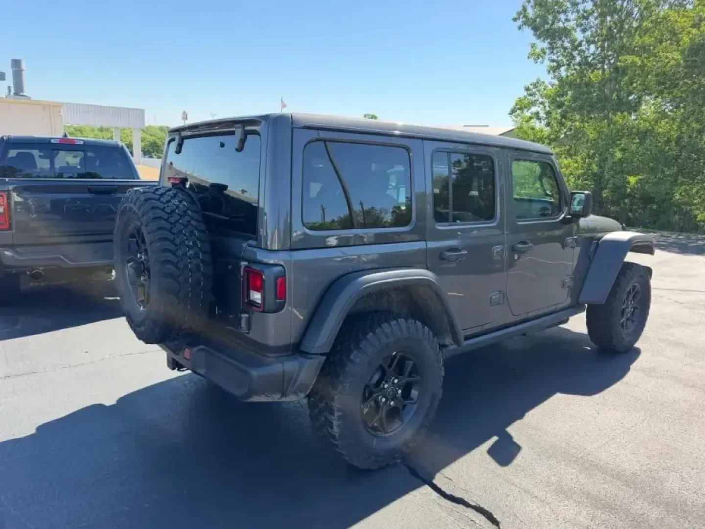 2026 /Black Cloth Jeep Wrangler Willys (1C4PJXDNXTW) with an 2.0L engine, 6M transmission, located at 970 Woodlawn Dr., Farmington, MO, 63640, (573) 431-7800, 37.825642, -90.468674 - Weekend trail runs at St. Joe State Park, a top-down cruise through downtown Farmington, or a confident commute out toward Park Hills and Bonne Terre-this 2026 Jeep Wrangler Sport is built for the kind of life that doesn't stay on pavement. With only **5 miles** on the odometer, it delivers that new - Photo#2