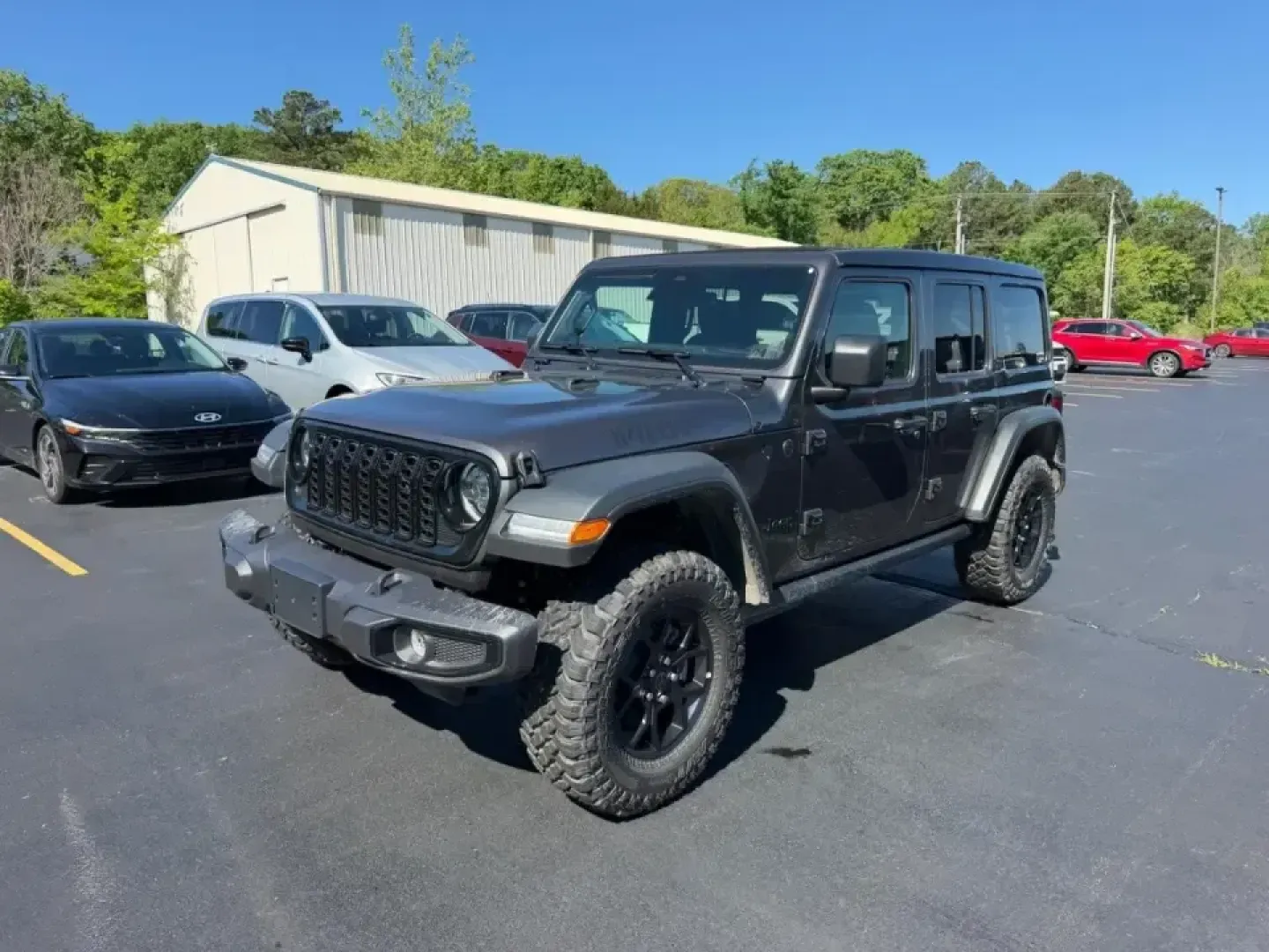 2026 /Black Cloth Jeep Wrangler Willys (1C4PJXDNXTW) with an 2.0L engine, 6M transmission, located at 970 Woodlawn Dr., Farmington, MO, 63640, (573) 431-7800, 37.825642, -90.468674 - Weekend trail runs at St. Joe State Park, a top-down cruise through downtown Farmington, or a confident commute out toward Park Hills and Bonne Terre-this 2026 Jeep Wrangler Sport is built for the kind of life that doesn't stay on pavement. With only **5 miles** on the odometer, it delivers that new - Photo#6