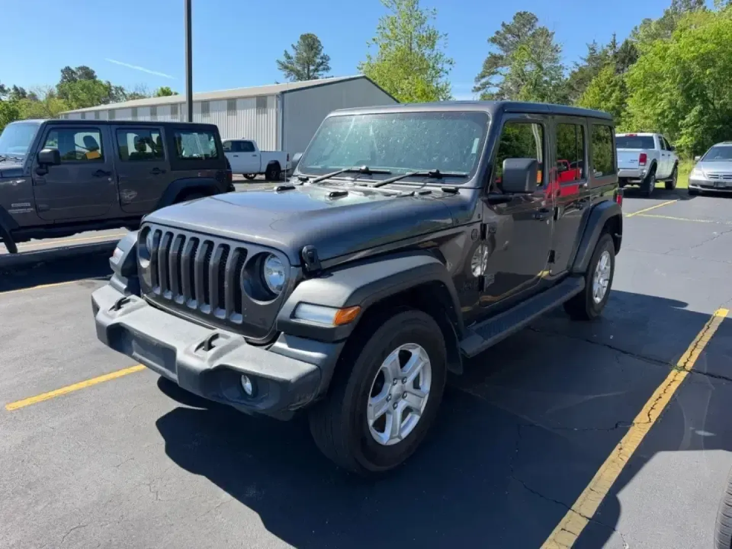 2022 /Black Cloth Jeep Wrangler Unlimited Sport RHD Right Hand Drive (1C4HJXKN9NW) with an 2.0L I4 DOHC DI Turbo engine, Automatic transmission, located at 970 Woodlawn Dr., Farmington, MO, 63640, (573) 431-7800, 37.825642, -90.468674 - Weekend adventures, daily commutes, and let's take the long way home drives feel better in a Wrangler-especially when you want real 4x4 capability with modern comfort. This 2022 Jeep Wrangler Unlimited Sport RHD (Right Hand Drive) is a unique SUV that stands out around Farmington, MO, whether you're - Photo#0
