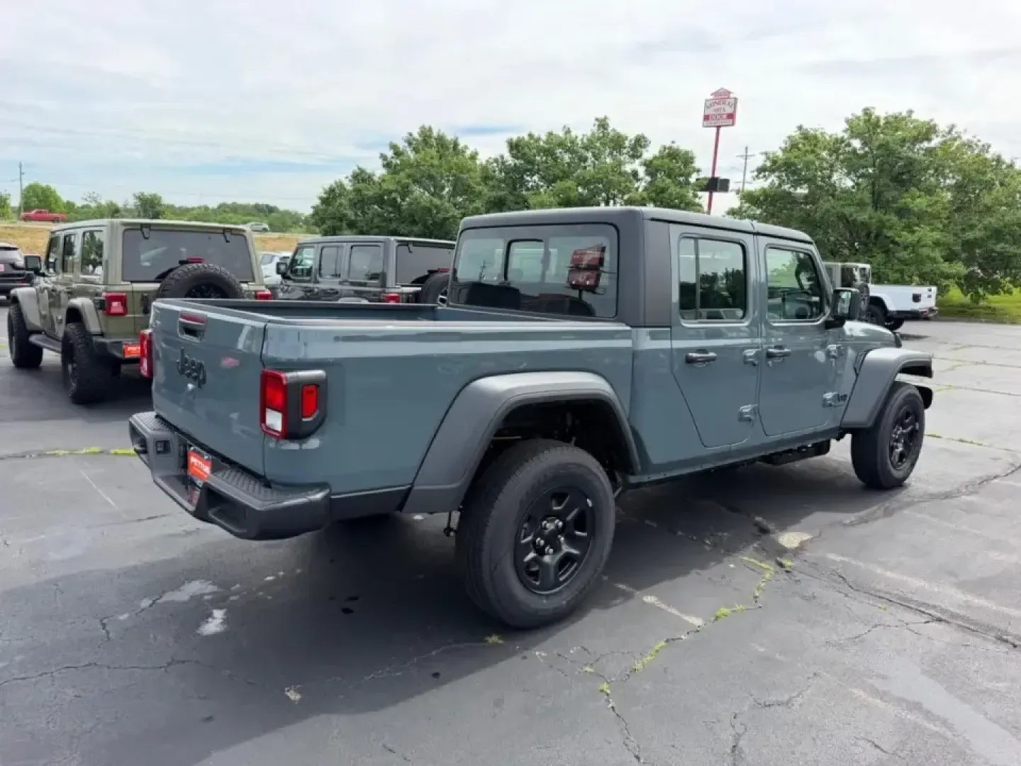 2026 /Black Cloth Jeep Gladiator Sport (1C6PJTAG9TL) with an 3.6L V6 engine, 6M transmission, located at 970 Woodlawn Dr., Farmington, MO, 63640, (573) 431-7800, 37.825642, -90.468674 - When your weekends bounce between hauling gear to St. Joe State Park, cruising K Highway for a quick lake day, and still needing a comfortable daily driver for the commute through Farmington, the right truck has to be more than tough-it has to fit your lifestyle. This 2026 Jeep Gladiator Sport 4WD i - Photo#2